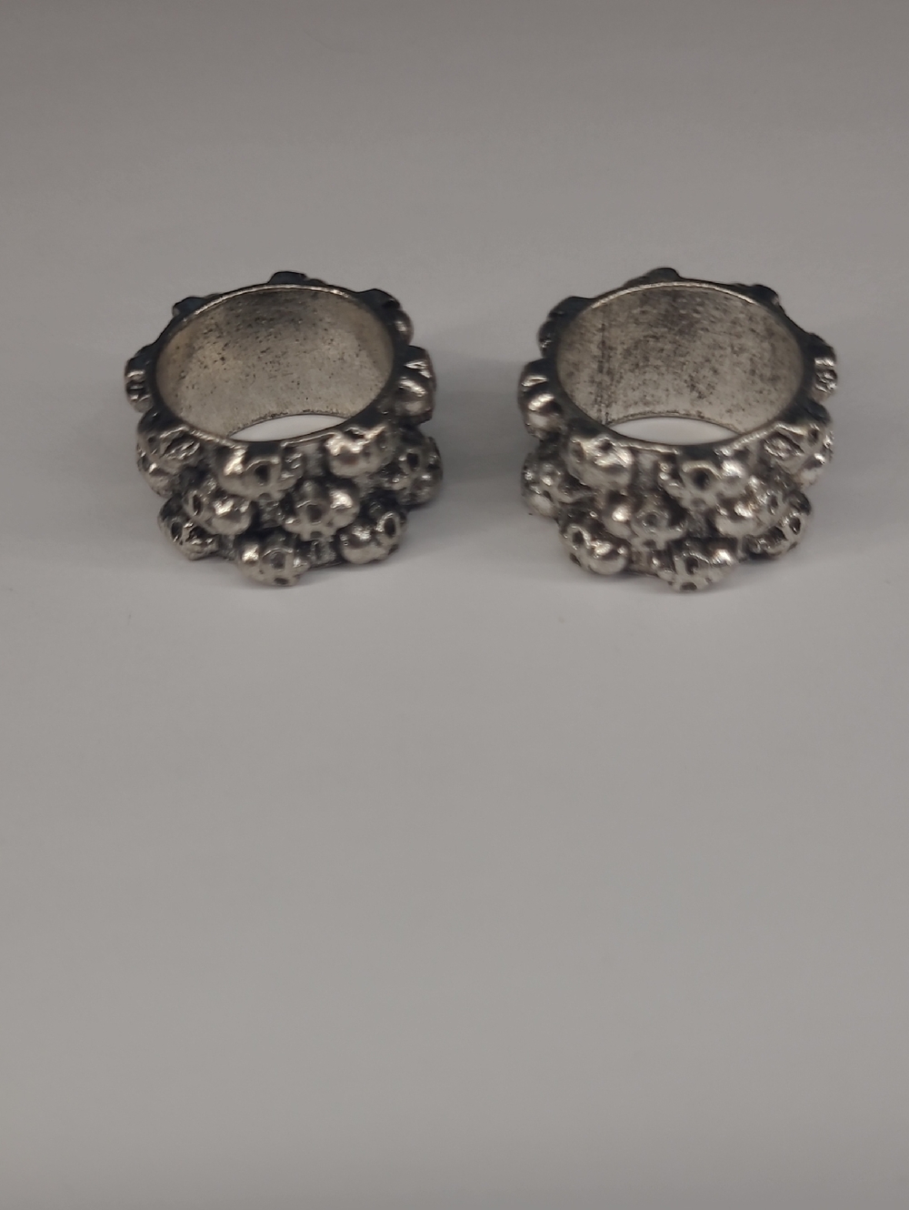 2 Matching Silver-Tone Skull Cluster Band Costume Rings